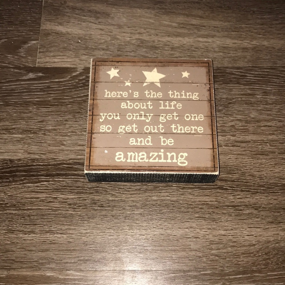 Brown and tan script wooden sign